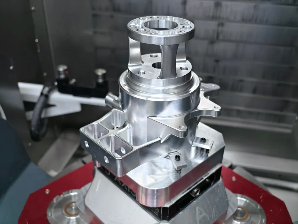 Custom CNC workholding fixture securely holding an aluminum component for precision CNC machining