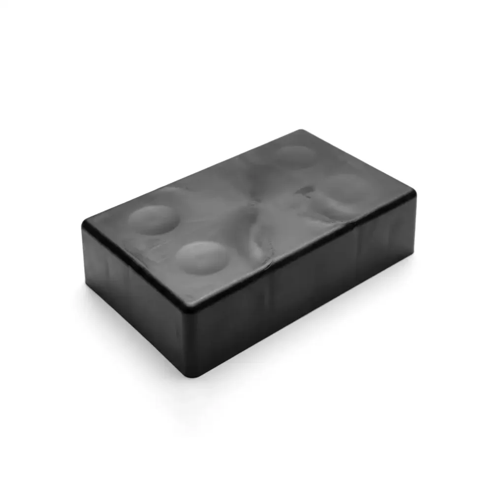 Surface sink marks on a black plastic injection molded part caused by uneven cooling in thick walls.