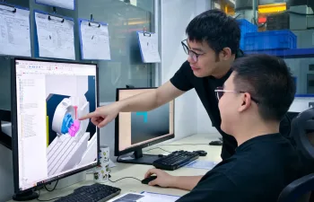 Procision engineers programming a CNC milling operation using 3D CAD software to ensure accurate tool paths and manufacturable design.