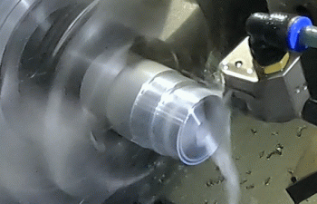 CNC turning machine cutting a part on a lathe during precision machining operation