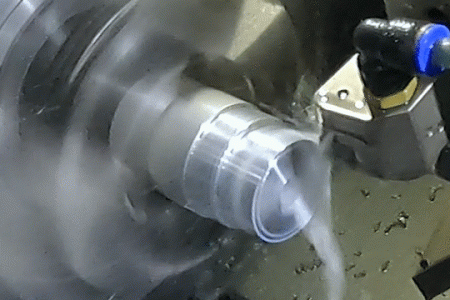 CNC turning machine cutting a part on a lathe during precision machining operation