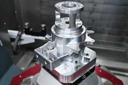 Custom CNC workholding fixture securely holding an aluminum component for precision CNC machining